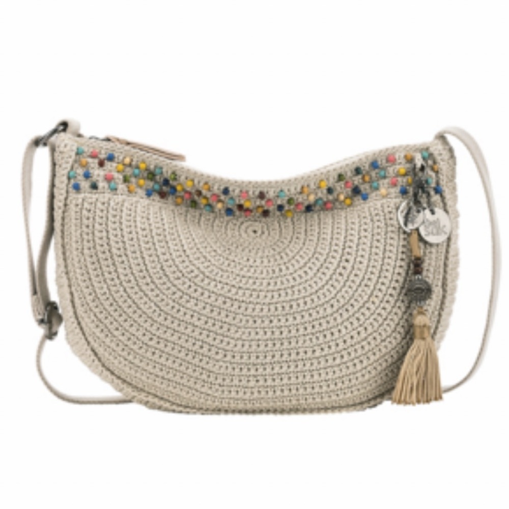 The Sak Cream Crossbody Bag with Bohemian Charm